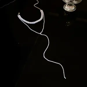 Detailed view of elegant sparkling rhinestone tassel necklace with Y-shaped drop design