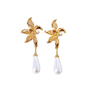 Elegant French style floral drop earrings with glossy teardrop pearls and golden finish