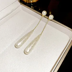 Elegant French vintage gold chain earrings with long teardrop pearls for women