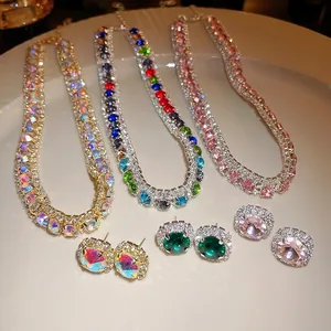 Close-up of luxury rhinestone zircon necklaces and stud earrings in various colors.