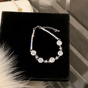 Elegant silver-toned chalcedony bracelet with sparkling zircon flower accents for women's fashion