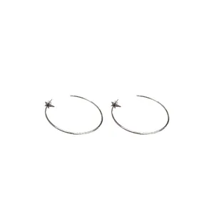 Elegant silver hoop earrings featuring minimalist zircon star charms on white backdrop
