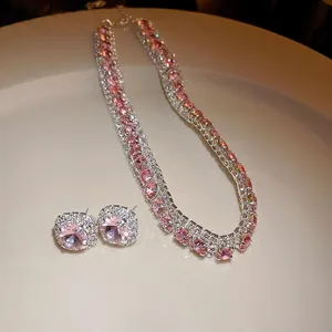 Exquisite pink zircon jewelry set featuring a necklace and earrings on a white tray