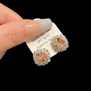 Close-up detail of pink square zircon stud earrings with crystal halo in S925 silver