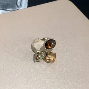 Elegant gold-plated adjustable open ring with square and round chocolate zircons