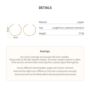Detailed specifications of 6cm large hoop earrings showing material and size info