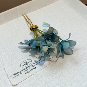 Elegant Korean style blue fabric flower hair fork with intricate gold finish metal pins.