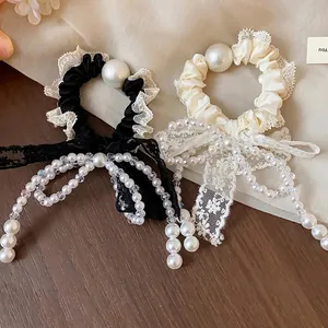 Elegant French lace bow hair scrunchie with faux pearl beads in black and cream colors