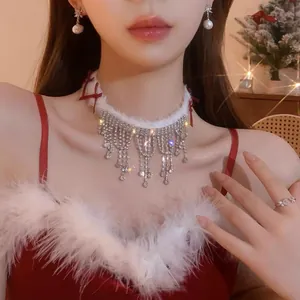 Sweet feather and bow choker necklace with sparkling crystal tassels worn by model