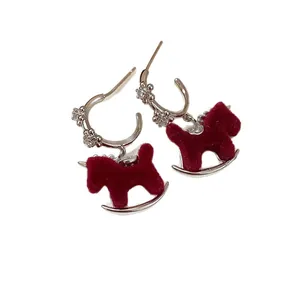 Elegant silver flower earrings with red flocked rocking horse pendants for New Year