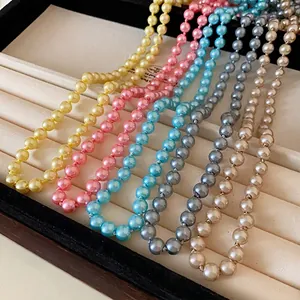 Multicolor long faux pearl necklaces in yellow, pink, blue, grey, and cream
