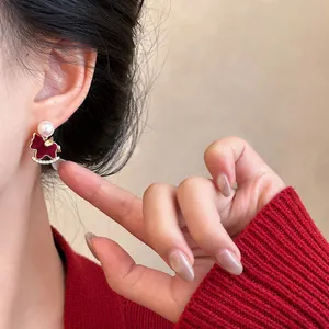 Elegant red rocking horse earrings with pearl and zircons on gold plated silver needle