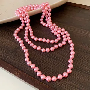 Long pink pearl necklace for women, layered elegant sweater chain with high-end texture.