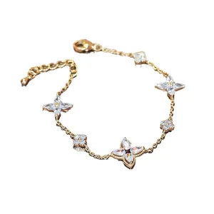 Elegant gold plated chain bracelet featuring sparkling zircon flower charms for women