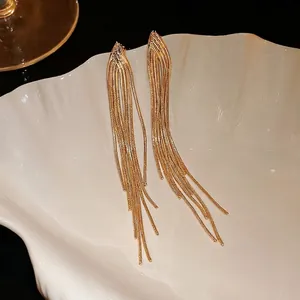 Elegant long gold tassel snake chain earrings with silver needles for stylish women