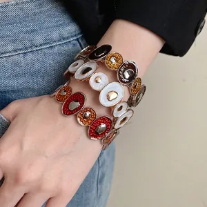Bracciale vintage in smalto a cerchi irregolari stile palazzo per donna dal design elegante
