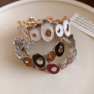 Bracciale vintage in smalto con cerchi irregolari giuntati in oro e stile multicolore