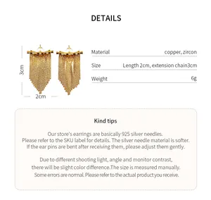 Vue détaillée des boucles d'oreilles franges en or 14K avec zircon et aiguilles en argent