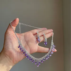 Elegant purple water-drop tassel necklace and earring set with shimmering rhinestones