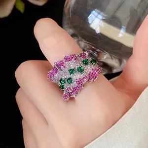 Elegant irregular pleated open ring featuring sparkling pink and green zircon stones