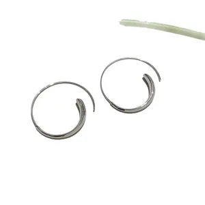 Elegant silver-toned geometric hoop earrings with a minimalist spiral design