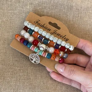 Set di braccialetti bohémien multistrato con perline di resina e ciondolo albero della vita