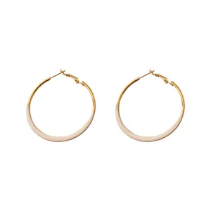 Elegant minimalist gold and beige enamel hoop earrings with premium silver needle posts.