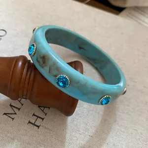 Vintage blue marbled resin bangle with blue rhinestone embellishments for women