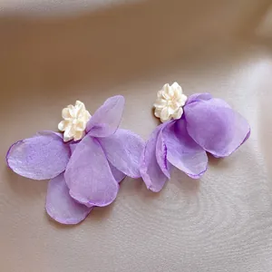 Elegant purple fabric flower petal earrings featuring a delicate white shell center detail
