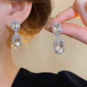Elegant French style oval crystal drop earrings with sparkling rhinestone halo