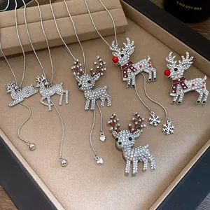 Detailed view of various silver reindeer necklaces with sparkling rhinestones for Xmas.
