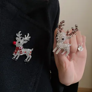 Detailed view of sparkling crystal reindeer brooches for Christmas accessory collection.