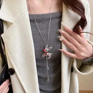 Elegant Christmas reindeer long necklace with sparkling crystals shown on a model