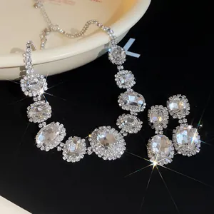 Macro view of French luxury oval crystal necklace and earring set with sparkling stones