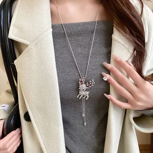 Detailed view of a sparkling rhinestone deer pendant necklace for Christmas styling.