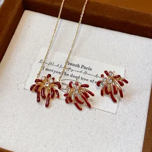 Exquisite 18k gold plated firework jewelry set with red enamel and shiny zircon stones.