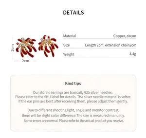 Close-up view of red firework earrings showing dimensions and material details