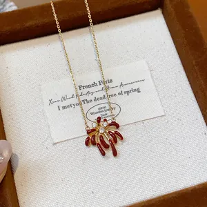 Close-up of an 18k gold-plated firework pendant necklace adorned with sparkling zircons.