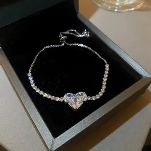 Close-up of sparkling heart zircon bracelet in an elegant black jewelry box