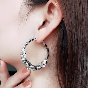 Fashionable exaggerated silver hoop earrings featuring sparkling rhinestones and shiny sequins