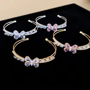 Elegant double-layer open bangle featuring a sparkling zircon butterfly and pearl detail.