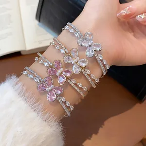 Close-up of stacked zircon butterfly double-layer open bangles for women