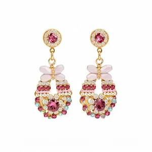 Vintage vergoldete Ohrhänger mit rosa Kristallen und Schleifendetails