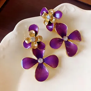 Vintage purple enamel flower drop earrings with rhinestones and gold-plated edges
