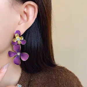 Vintage purple floral drop earrings with sparkling rhinestones and silver needles