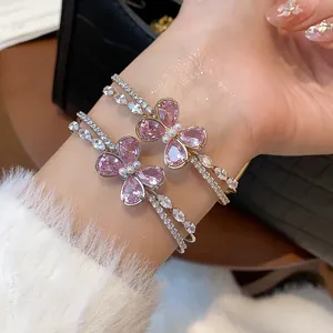 Detailed view of elegant pink zircon butterfly double-layered open cuff bangle.
