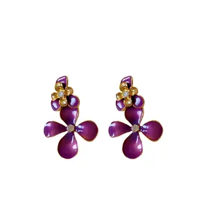Elegant purple enameled flower drop earrings with sparkling crystals and gold plating