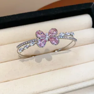 Detailed macro view of elegant silver-toned double-layer zircon butterfly open bangle
