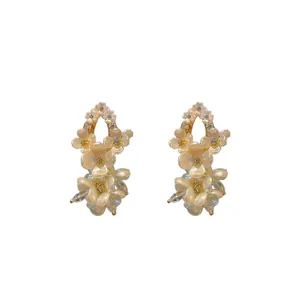 Elegant shell flower stud earrings with shimmering zircon accents and vintage gold-plated finish