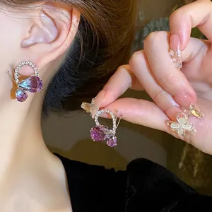 Elegant butterfly waterdrop earrings with purple crystals and sparkling rhinestones for women.